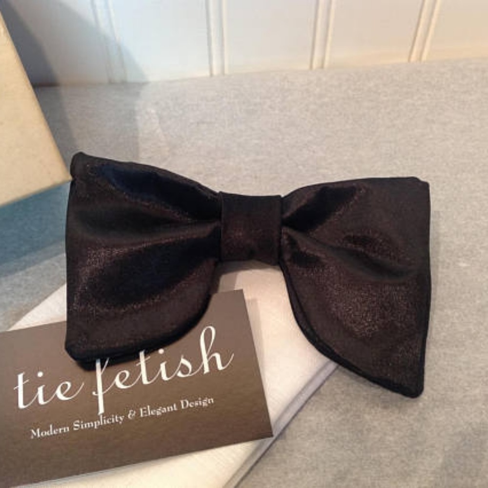 Oversized black satin bow tie